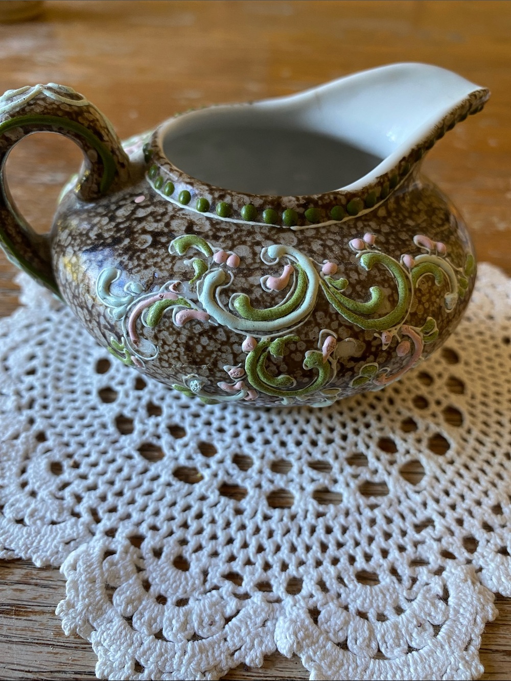 Brown Ceramic Creamer with Green and Pink Raised Scrollwork